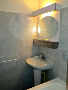 a bathroom with a sink and a mirror at Annapolis in Aix-les-Bains