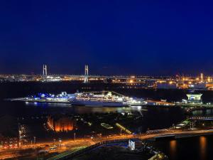a view of a river at night with a city at APA Hotel & Resort Yokohama Bay Tower in Yokohama
