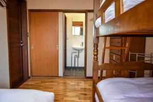 Postel nebo postele na pokoji v ubytování Panketo Lodge & Yoga Studio