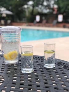 a table with two glasses of water and lemon slices at Calloway Inn and Suites in Hammond