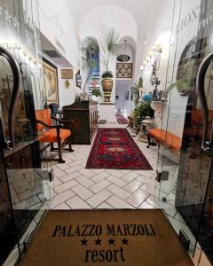 a hallway with a room with a rug on the floor at Palazzo Marzoli charme Resort - Small Luxury Hotel in Positano