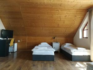 Ένα ή περισσότερα κρεβάτια σε δωμάτιο στο Manoka Guest House