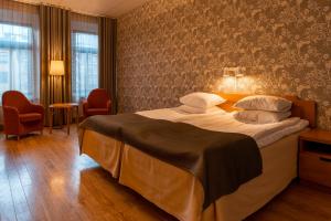 Säng eller sängar i ett rum på Hotel Lorensberg
