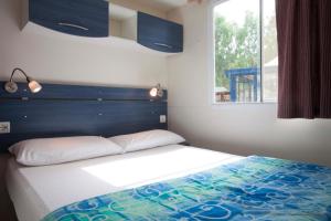 Säng eller sängar i ett rum på Camping Village Cavallino