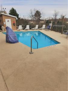 a swimming pool with a blue tarp around it at Comfort Inn & Suites Asheboro East in Asheboro
