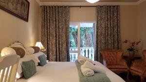 Ліжко або ліжка в номері Villa Lugano Guesthouse