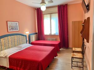 Postel nebo postele na pokoji v ubytování Albergo Cinzia