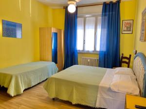 Katil atau katil-katil dalam bilik di Albergo Cinzia