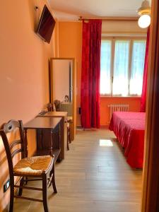 Postel nebo postele na pokoji v ubytování Albergo Cinzia