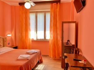 Postel nebo postele na pokoji v ubytování Albergo Cinzia