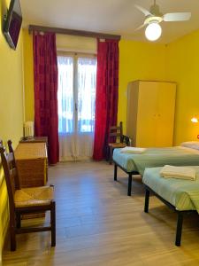 Postel nebo postele na pokoji v ubytování Albergo Cinzia