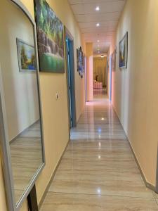 a hallway in a hospital with a mirror at Albergo Cinzia in Florence