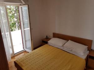 Posteľ alebo postele v izbe v ubytovaní Apartments Ivana Diklo