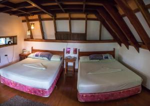 Кровать или кровати в номере AABANA Beach & Watersport Resort