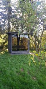 a building in the middle of a field of grass at N8Quartier Chalet in Bad Münstereifel