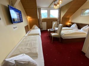 En eller flere senger på et rom på Hotel Turnerwirt