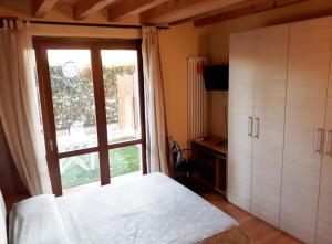 Posteľ alebo postele v izbe v ubytovaní Albergo La Quiete