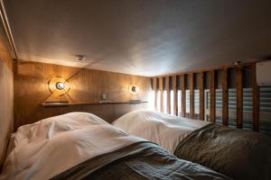 Кровать или кровати в номере Mochida Hall 1F / Vacation STAY 80337