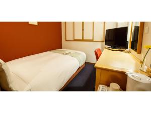 Ένα ή περισσότερα κρεβάτια σε δωμάτιο στο Hakata Floral Inn Nakasu / Vacation STAY 80206
