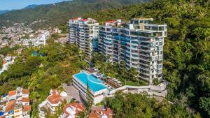 an aerial view of a building on a hill at AVALON - 1002 Amapas Bay Bliss with Private Pool in Puerto Vallarta