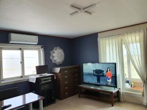 A television and/or entertainment centre at Yonghyun's house