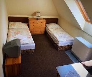 Postel nebo postele na pokoji v ubytování Penzion Na Prachárně