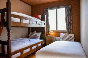 Postel nebo postele na pokoji v ubytování Panketo Lodge & Yoga Studio