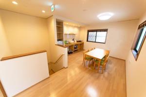 a kitchen and dining room with a table and chairs at Kyoto Backyard Fox in Kyoto +18 photos