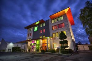 a building with colorful lights on the side of it at ibis Styles Bethune Bruay la Buissière in Bruay-la-Buissiere