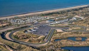 an aerial view of a parking lot next to the ocean at Queens Romantic Beachhouse in Zandvoort