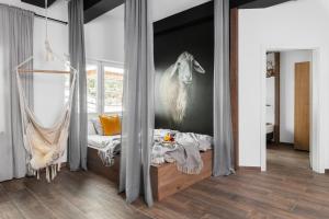 Postel nebo postele na pokoji v ubytování Aparthotel Narciarska 2