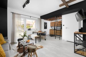 Televiisor ja/või meelelahutuskeskus majutusasutuses Aparthotel Narciarska 2