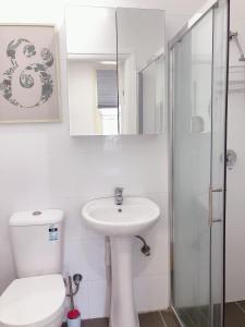 a bathroom with a toilet and a sink and a shower at Private Studio-room In Kingsford with Kitchenette and Private Bathroom Near UNSW, Randwick 5 - ROOM ONLY in Sydney