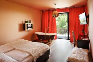 Televízia a/alebo spoločenská miestnosť v ubytovaní Weingartenhotel Harkamp Südsteiermark