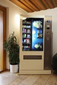 a vending machine with drinks in a room at Hotel Heuberger Hof, Wehingen in Wehingen