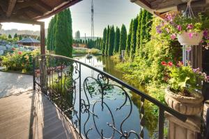a balcony with a view of a river at Hotel David with Free Parking in Košice