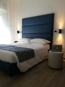 Letto o letti in una camera di Hotel Rombino