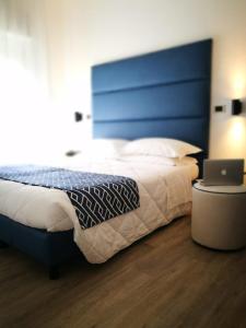Letto o letti in una camera di Hotel Rombino