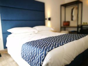Letto o letti in una camera di Hotel Rombino