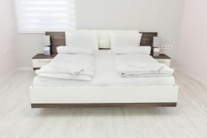 Posteľ alebo postele v izbe v ubytovaní Corso Lux Apartman