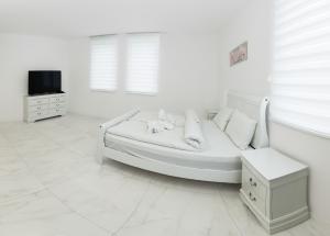 Posteľ alebo postele v izbe v ubytovaní Corso Lux Apartman