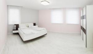 Posteľ alebo postele v izbe v ubytovaní Corso Lux Apartman