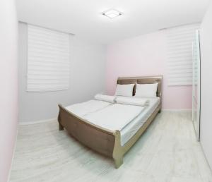 Posteľ alebo postele v izbe v ubytovaní Corso Lux Apartman