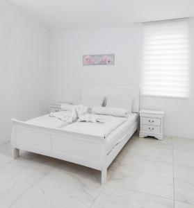 Posteľ alebo postele v izbe v ubytovaní Corso Lux Apartman