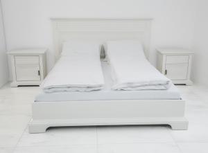 Posteľ alebo postele v izbe v ubytovaní Corso Lux Apartman