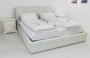 Posteľ alebo postele v izbe v ubytovaní Corso Lux Apartman
