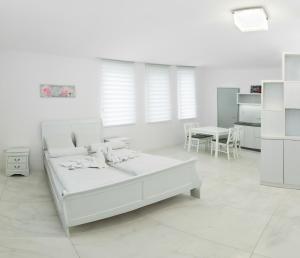 Posteľ alebo postele v izbe v ubytovaní Corso Lux Apartman