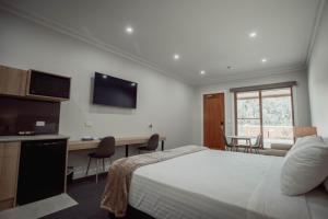 Ein Bett oder Betten in einem Zimmer der Unterkunft Red Waratah Accommodation