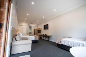 Ein Bett oder Betten in einem Zimmer der Unterkunft Red Waratah Accommodation