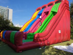 a large inflatable water slide in a park at Hotel Capitol in Jupiter